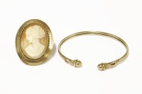 Lot 24 - A 9ct gold torque bangle with sphere finials
