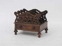 Lot 571 - A Victorian walnut Canterbury