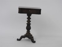 Lot 517 - A Regency rosewood pedestal sewing table