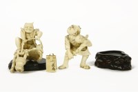 Lot 97 - A Japanese ivory figure of a Samurai drawing his sword