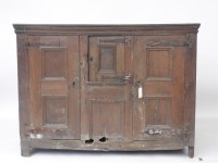 Lot 447 - A 17th century Dutch panelled door cupboard