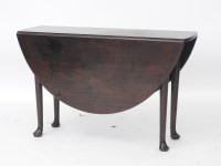 Lot 488 - An 18th century oval mahogany two flap table