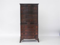 Lot 443 - A reproduction serpentine chest on chest