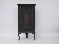 Lot 577 - An 18th century style carved oak corner cupboard