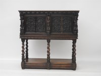 Lot 580 - An oak cupboard on stand