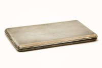 Lot 132 - An engine turned silver and copper banded cigarette case