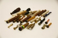 Lot 88 - A collection of Victorian and later pipe tampers and seals