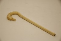 Lot 80 - An early 20th century carved ivory swan's head parasol handle
