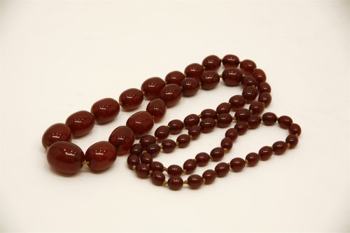 Lot 56 - A cherry amber bead necklace
