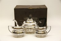 Lot 273 - A Mappin & Webb three piece silver plated tea set in original box