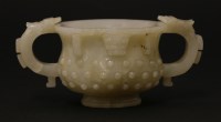 Lot 137 - A Chinese jade two-handled cup
