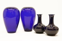 Lot 220 - A pair of blue glass vases together with a pair of blue glazed porcelain vases