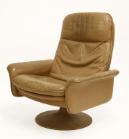 Lot 519 - A De Sede tan leather reclining lounger