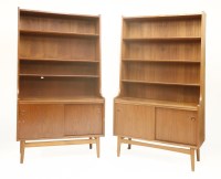 Lot 540 - A pair of Danish teak high-sided cabinets