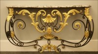 Lot 626 - A wrought iron and gilt console table