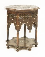 Lot 557 - A Syrian hardwood and mother-of-pearl table
late 19th century