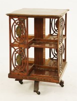 Lot 559 - An Edwardian Sheraton Revival satinwood revolving bookcase