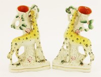 Lot 13 - A pair of 'Giraffe' Staffordshire spill vases