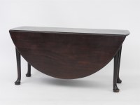 Lot 521 - A large Georgian mahogany gate leg dining table