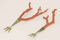 Lot 426 - A pair of Victorian silver gilt trident forks with red coral branch handles