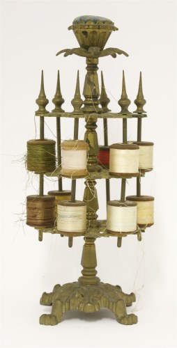 Lot 146 - A Victorian brass three tier cotton reel stand
