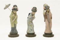 Lot 179 - Three Lladro china figures