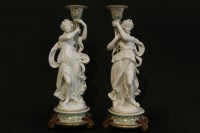 Lot 145 - A pair of Classical design porcelain candlesticks