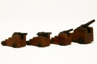 Lot 162A - A set of four miniature cannons on stepped wooden bases and wheels