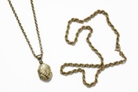 Lot 10 - A rolled gold locket on a 9ct gold belcher chain