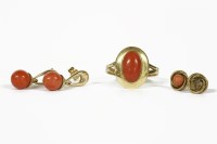 Lot 1 - An Italian gold single stone coral cabochon ring marked 750