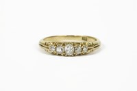 Lot 23 - A gold five stone graduated diamond ring marked 18ct
