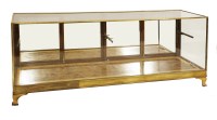 Lot 571 - An Edwardian mahogany and brass-framed shop display counter