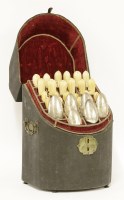 Lot 437 - An associated set of twelve knives and twelve forks in associated back fish skin standing box