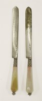 Lot 462 - A pair of amber-handled wedding knives