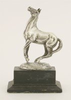 Lot 477 - A modern silver model of a stallion on a plinth