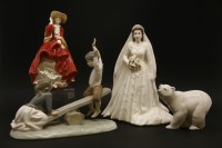 Lot 212 - Ceramic figures: a Lladro eskimo and polar bear group
