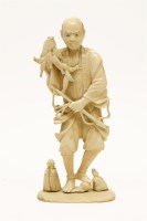 Lot 129 - A Meiji period ivory Okimono of a Japanese fisherman
