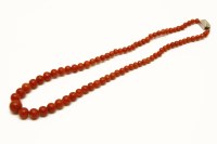Lot 29 - A single row graduated coral bead necklace