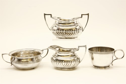 Lot 89 - A 20th century silver cream jug with half gadrooned body