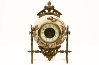 Lot 245 - A Victorian pottery and spelter mantel clock
