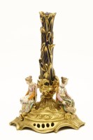 Lot 143 - A mid 19th century triform candlestick