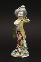 Lot 174 - A Bow figure of a boy in a yellow coat