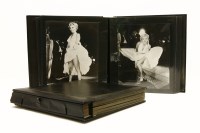 Lot 82 - Two photograph albums containing a number of modern photographic prints of Marilyn Monroe (2)