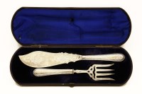 Lot 102 - A pair of Victorian silver fish servers in fitted case