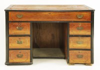 Lot 561 - A camphorwood and ebony campaign desk