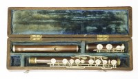 Lot 190 - A Isidor Lot rosewood and nickel-mounted flute