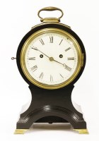 Lot 443 - An ebonised mantel clock