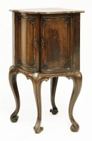 Lot 529 - A serpentine-fronted corner cabinet