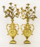 Lot 116 - A pair of gilt metal five-branch candelabra