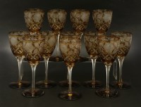 Lot 74 - A set of twelve amber cut glass wine glasses